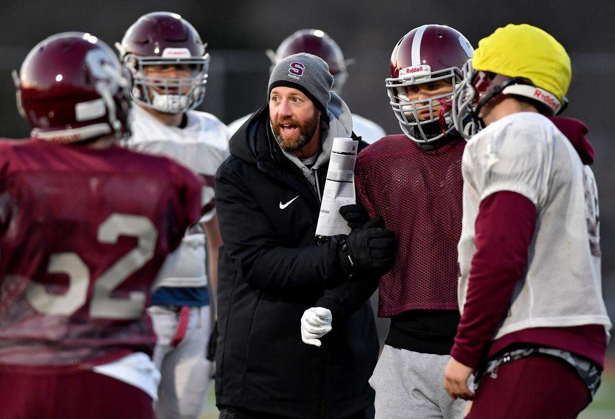 State College football coach Matt Lintal talks to his players during practice on Tuesday, Nov. 30, 2021. The Little Lions will face Mount Lebanon in the PIAA class 6A semifinals on Saturday.