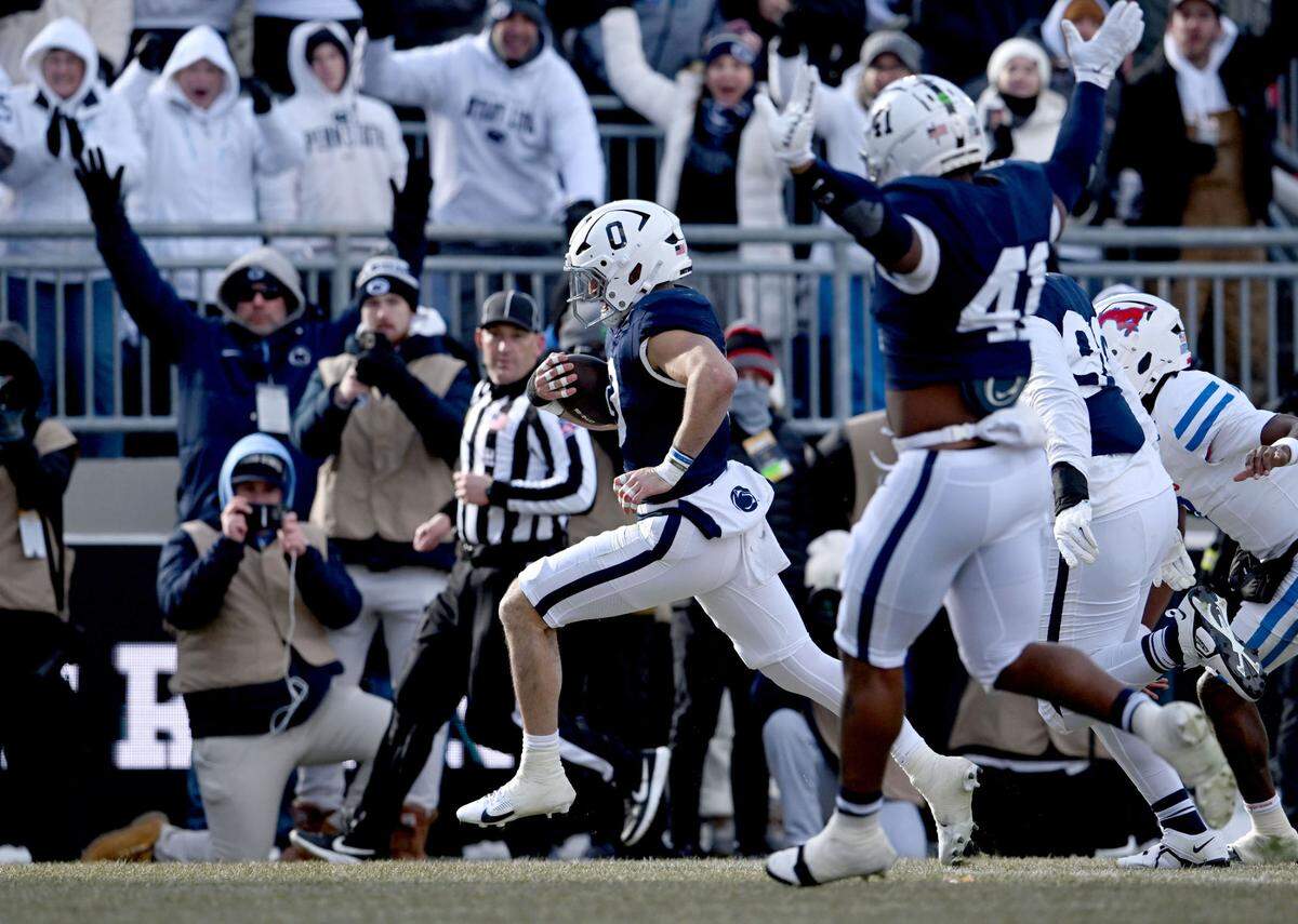 Penn State linebacker Dominic DeLuca runs in for a touchdown after making an interception during the game against SMU on Saturday, Dec. 21, 2024 at Beaver Stadium.