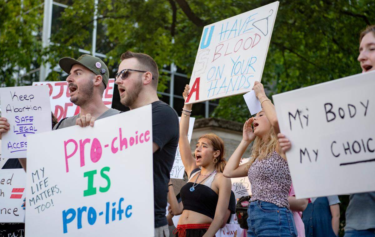 Protesters gathered and marched in downtown State College Friday evening after the U.S. Supreme Court overturned Roe v. Wade.