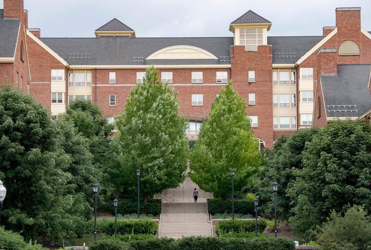 A man walks up the steps of the Eastview Terrace Apartments on the Penn State campus on Thursday, July 16, 2020.