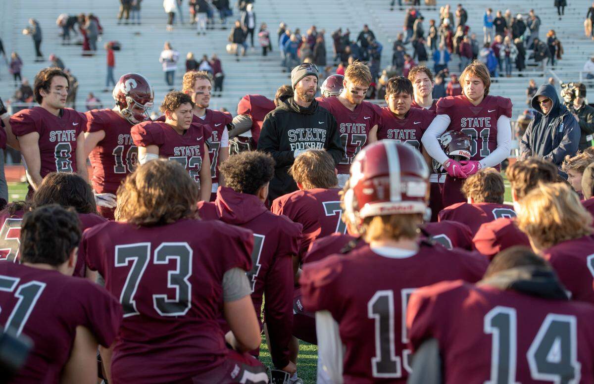 State College football coach Matt Lintal talks to his players and praises the seniors after the loss to Mt. Lebanon in the PIAA class 6A semifinal game on Saturday, Dec. 4, 2021 at Mansion Park.