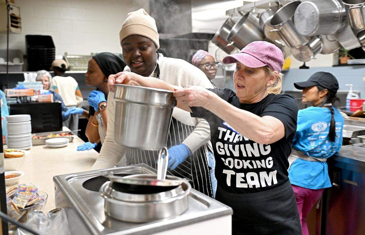 Sandy Wigfield replenishes the goulash during the Community Café meal at St. Andrew’s Episcopal Church on Thursday, Nov. 20, 2025.