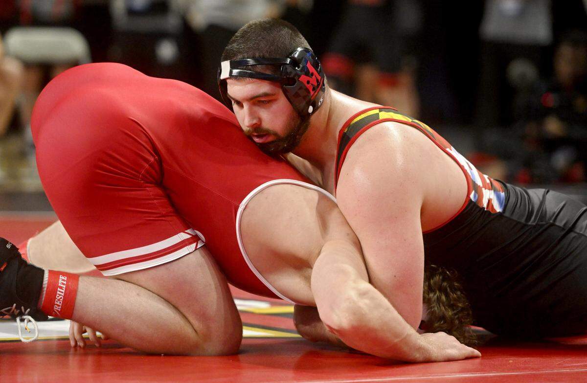 Maryland’s Seth Nevills controls Wisconsin’s Gannon Rosenfeld in a 285 lb first round match of the Big Ten Wresting Championships at the Xfinity Center at the University of Maryland on Saturday, March 9, 2024.