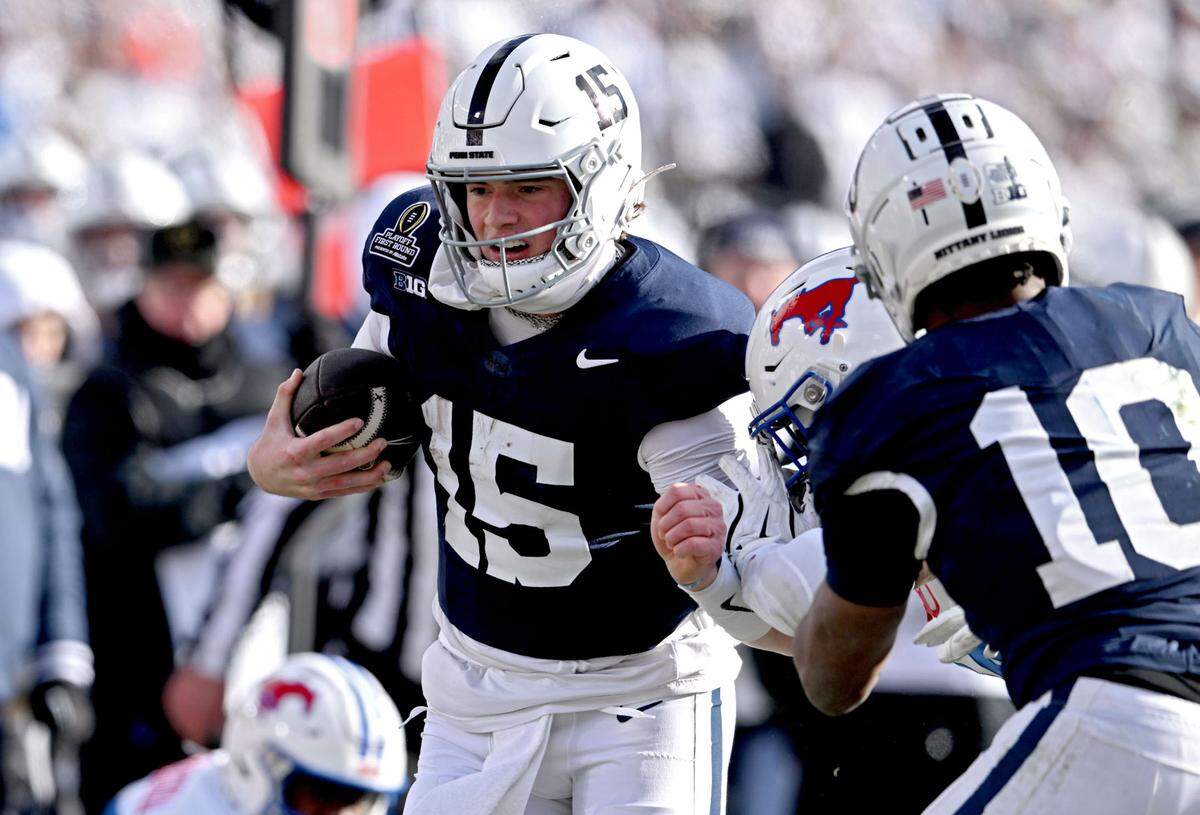 Penn State quarterback Drew Allar tries to push around SMU defenders during the game on Saturday, Dec. 21, 2024 at Beaver Stadium.