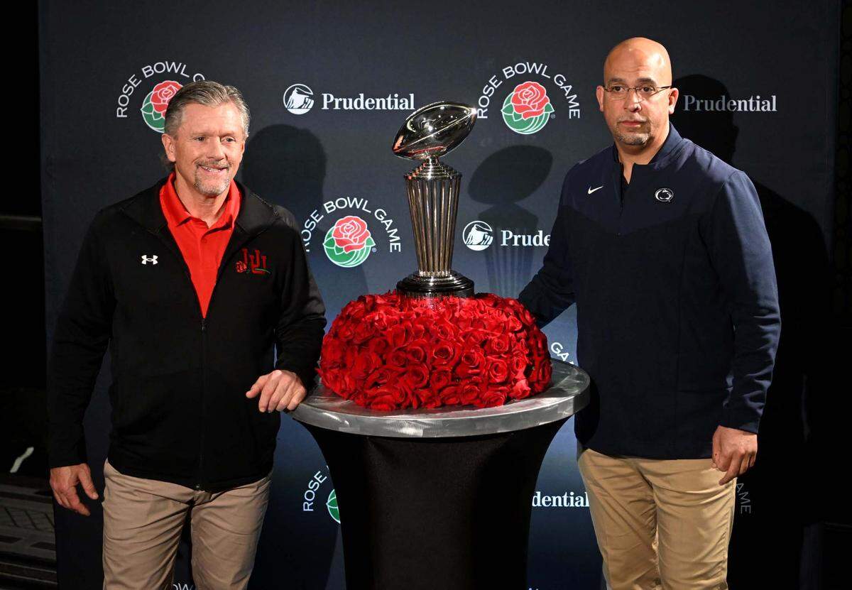Utah coach Kyle Whittingham and Penn State coach James Franklin stand next to the Leishman Trophy after the press conference for the Rose Bowl on Sunday, Jan. 1, 2023.