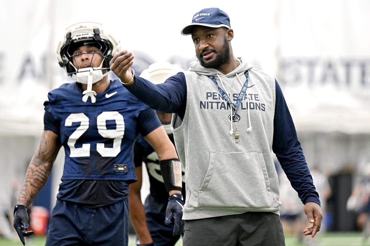 Penn State running backs coach Savon Huggins directs players during spring practice on Thursday, March 26, 2026.  