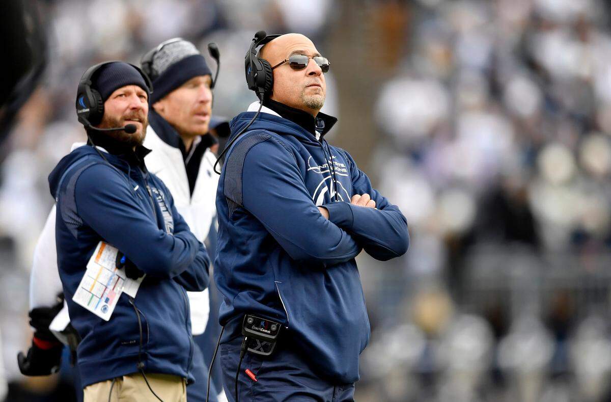 Penn State football coach James Franklin watches a replay during the game against Rutgers on Saturday, Nov. 20, 2021.