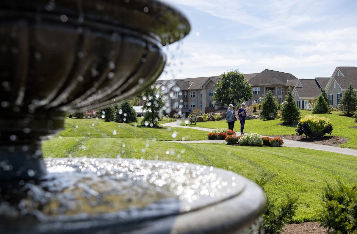 Residents check out the new walking paths of the Palmer Park at the Village at Penn State during the grand opening on Sept. 17.