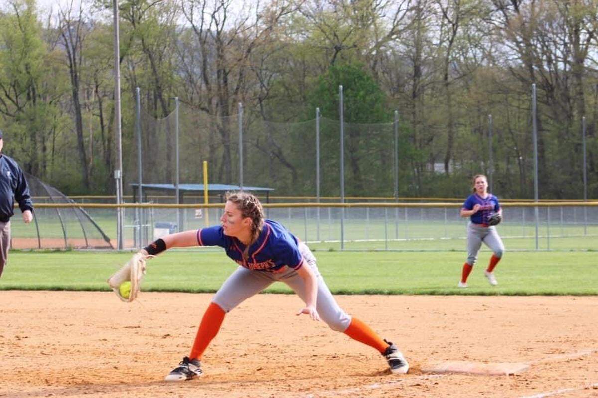 Saint Joseph Catholic Academy’s Jordyn Rose stretches to catch a teammate’s throw to first base.