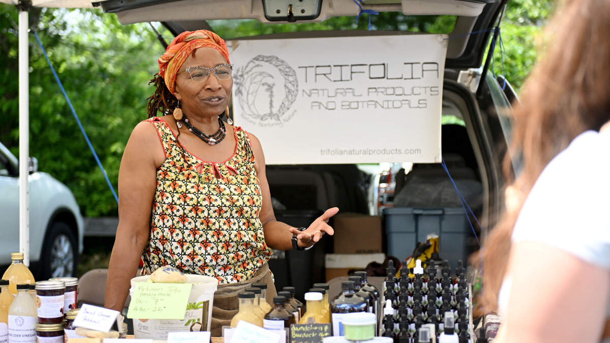Yasoda Mensah talks about products that she makes and sells at her stand Trifolia Natural Products and Botanicals at the Boalsburg Farmers Market on Tuesday, June 23, 2026.