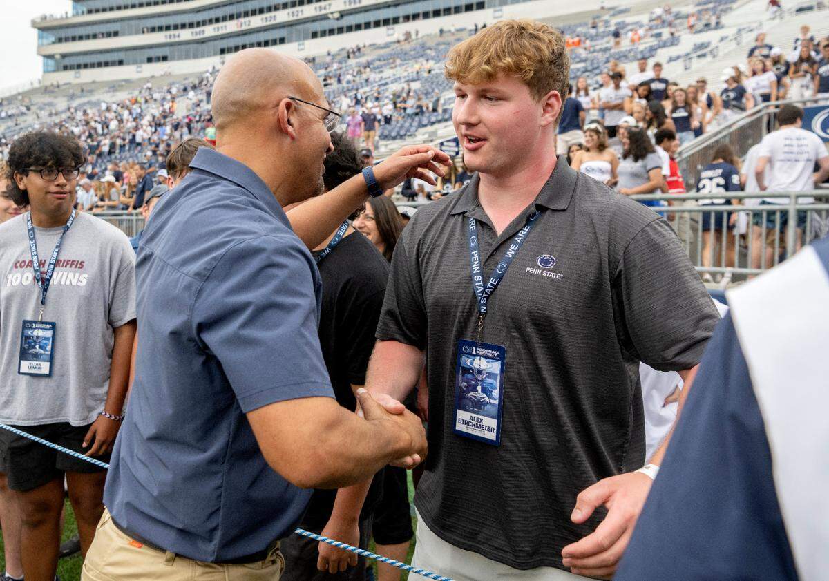 Penn State football coach James Franklin greets recruit Alex Birchmeier after the win over Ohio on Saturday, Sept. 10, 2022.