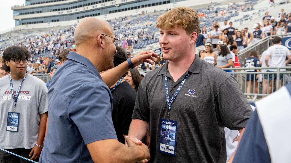 Penn State football coach James Franklin greets recruit Alex Birchmeier after the win over Ohio on Saturday, Sept. 10, 2022.