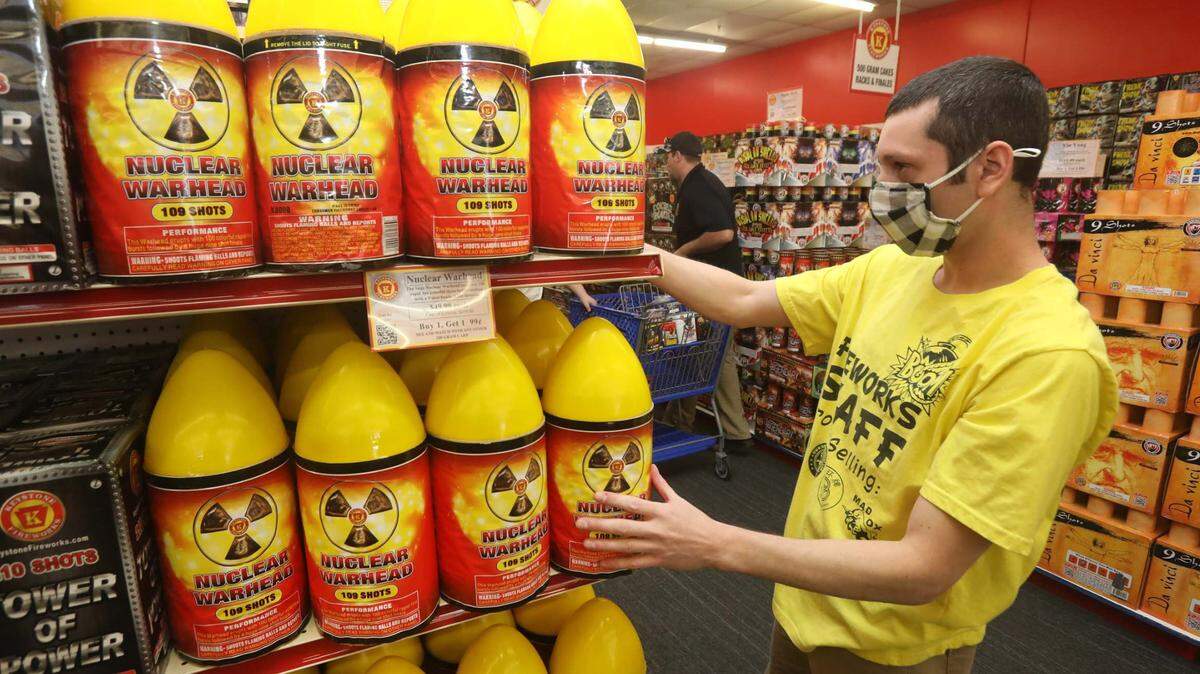 Keystone Fireworks staff member Wayne Thomas adjusts some products at the store on Carey Avenue in Wilkes-Barre on Sunday. The store said it is fully stocked thanks to ordering early.