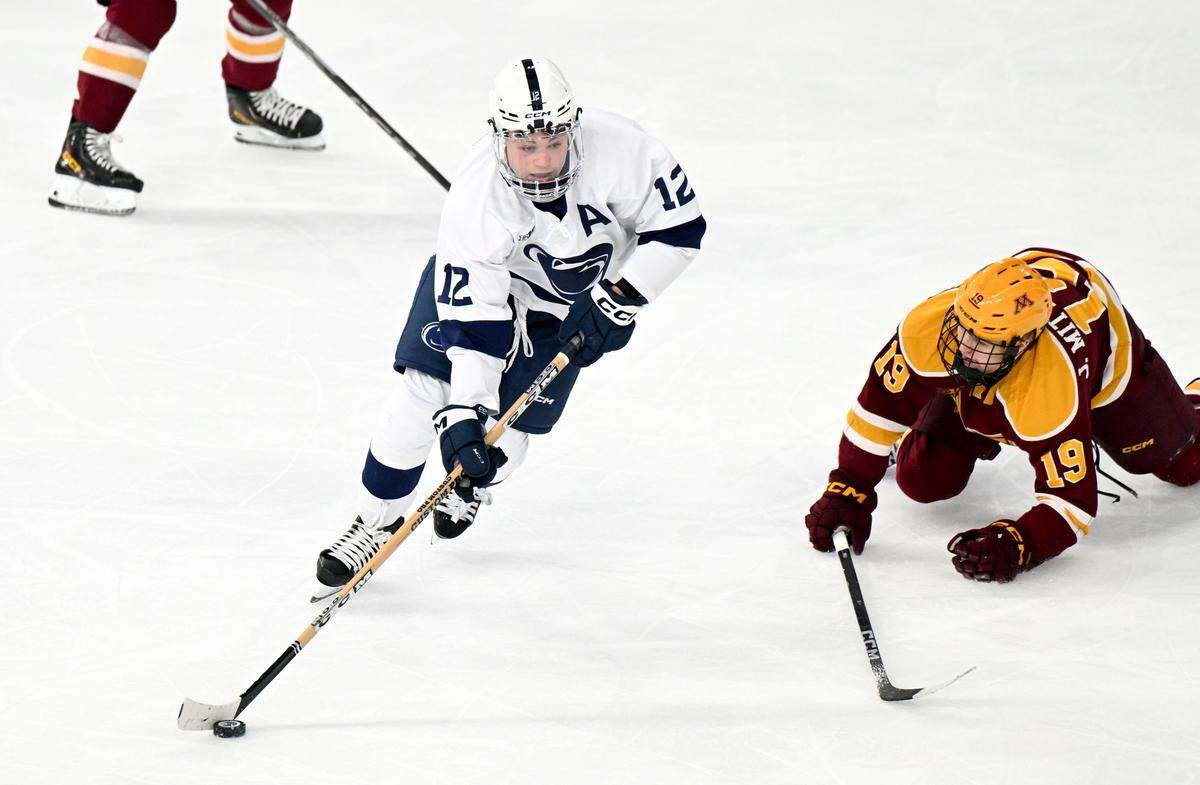 Penn State's Ben Schoen cuts around Minnesota’s August Falloon during the game on Wednesday, March 11, 2026 at Pegula Ice Arena. 
