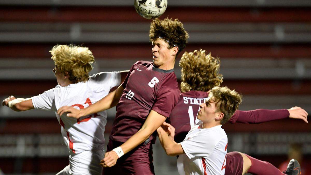 State College’s Carson Litzinger heads the ball during the game against Peters Township in the first round of the PIAA tournament on Tuesday, Nov. 9, 2021 at Memorial Field.