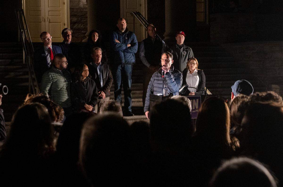 Surrounded by fellow Democrats, Pennsylvania gubernatorial candidate Josh Shapiro speaks during a rally outside of Old Main on Wednesday, Nov. 2, 2022.
