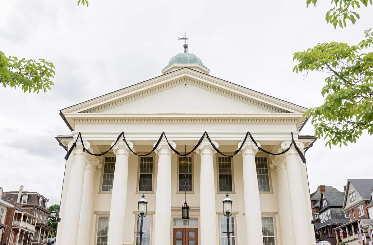 Black bunting was draped on the Centre County Courthouse and the flag was at half-mast on Friday, May 22, 2026 to honor retired Centre County President Judge David E. Grine.