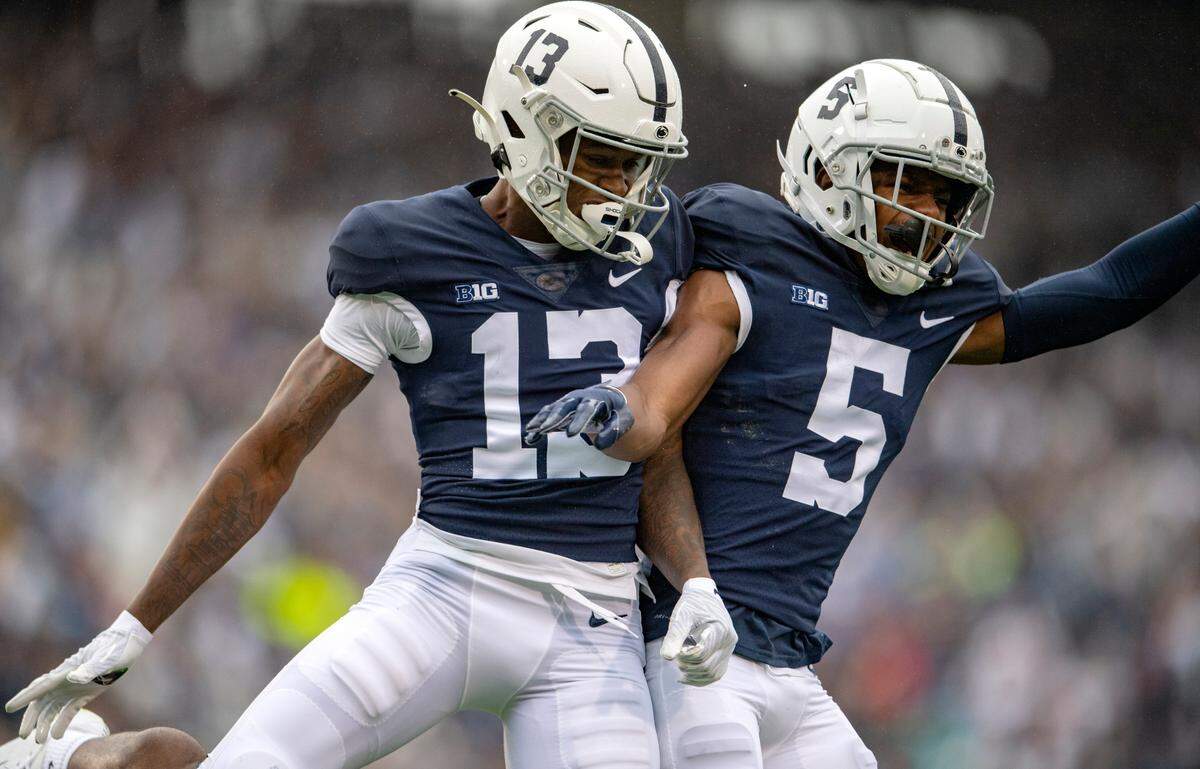 Penn State wide receivers KeAndre Lambert-Smith and Jahan Dotson celebrate Lambert-SmithÕs touchdown in the first quarter of the game against Illinois on Saturday, Oct. 23, 2021.