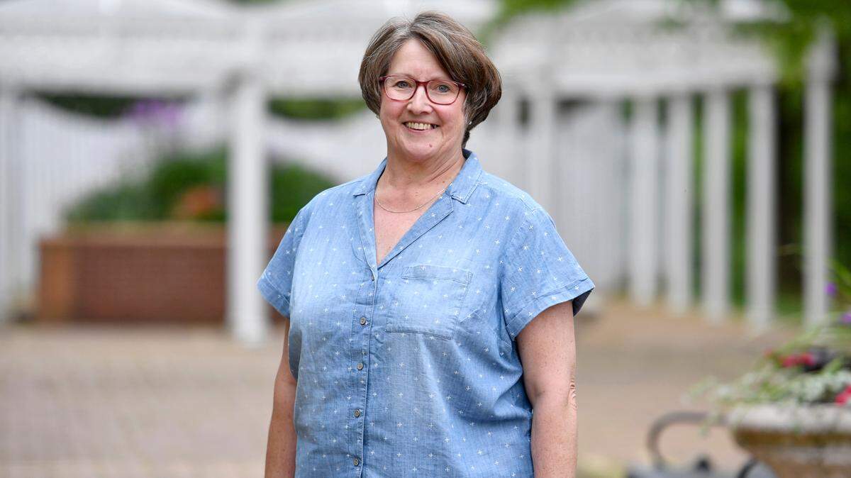 Patti Long poses in Talleyrand Park on May 24. Long organizes food distributions, community events and more in Howard.