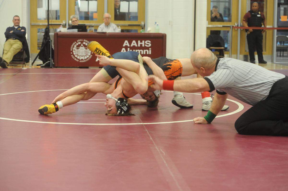 Bald Eagle Area’s Jeffre Pifer scores nearfall points on Tyrone’s Lukas Walk during their 138-pound quarterfinals match of the District 6 Class 2A Championships on Friday, Feb. 18, 2022. Pifer edged Walk, 6-0, to make the semifinals.