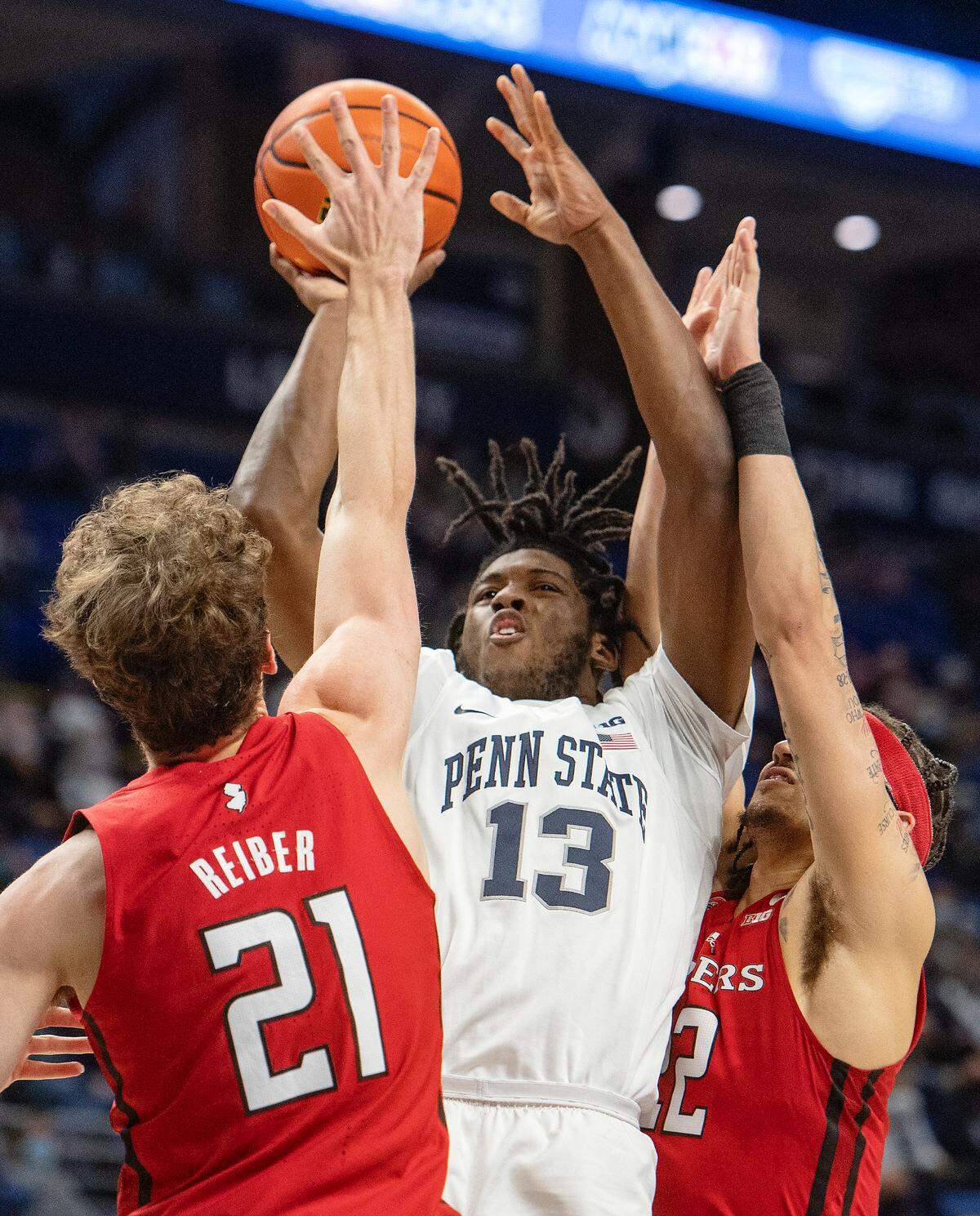Penn State’s Jevonnie Scott looks to the basket over Rutgers defenders during the game on Tuesday, Jan. 11, 2022.
