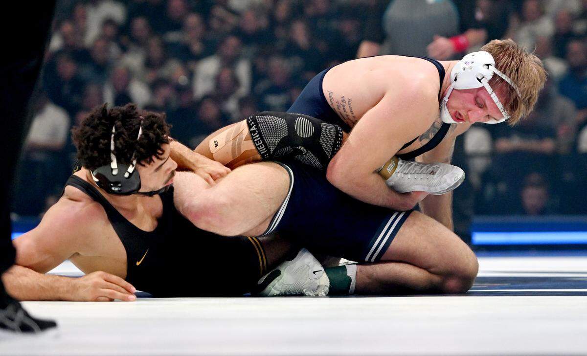 Penn State’s Josh Barr wrestles Iowa’s Stephen Buchanan in the 197-pound bout of the match on Friday, Jan. 31, 2025 at the Bryce Jordan Center.