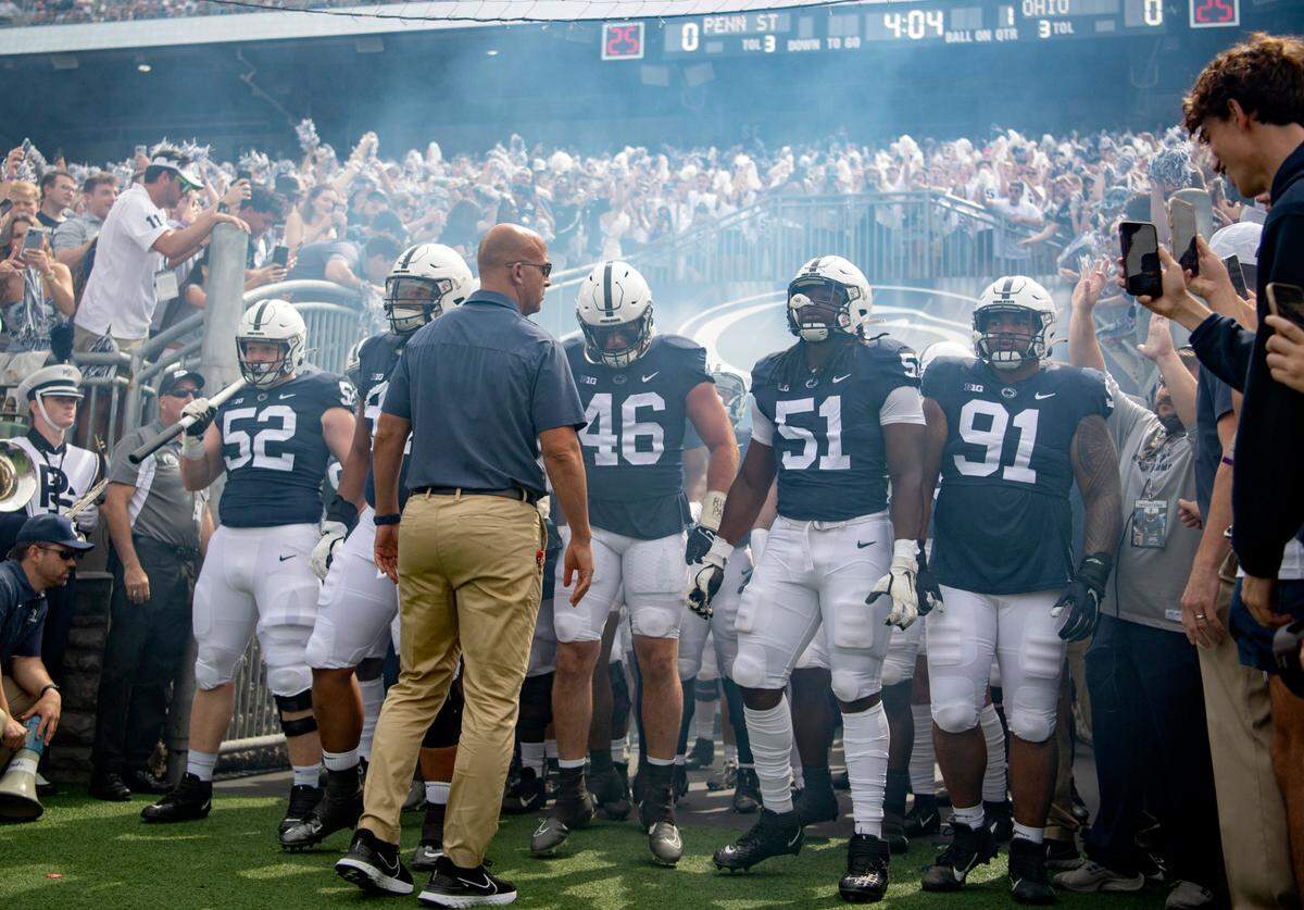 Fans cheer as the Penn State football team comes out for the game against Ohio on Saturday, Sept. 10, 2022.