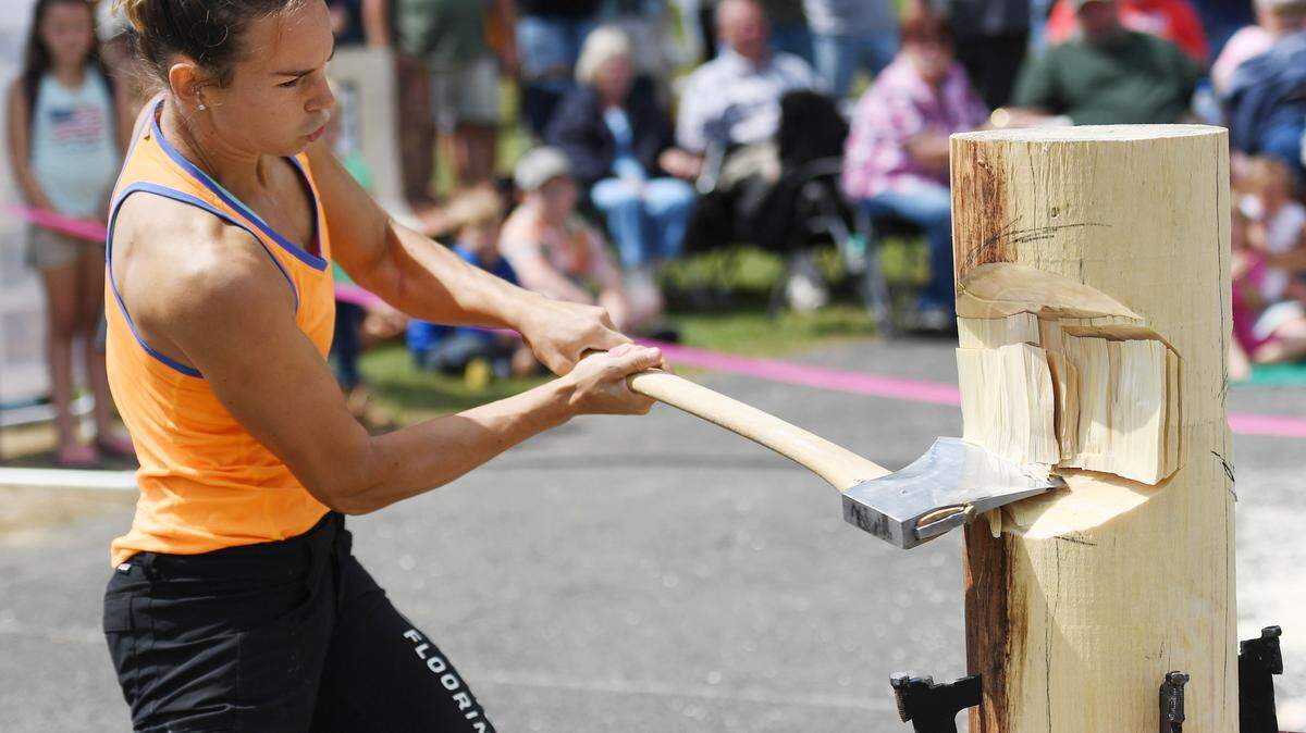 Martha King participates in the standing block chop during the 2017 Lumberjack Competition at Grange Fair.
