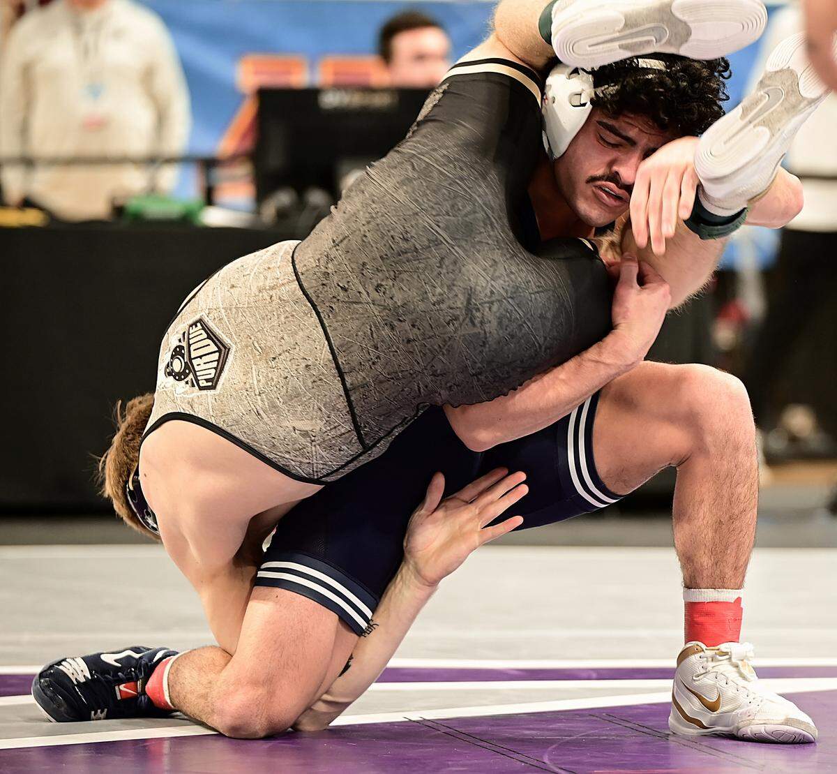 Penn State’s Beau Bartlett scrambles with Purdue’s Greyson Clark in their 141-pound quarterfinals match of the Big Ten Championships on March 8 inside Welsh Ryan Arena in Evanston, Ill. Bartlett beat Clark, 13-3.