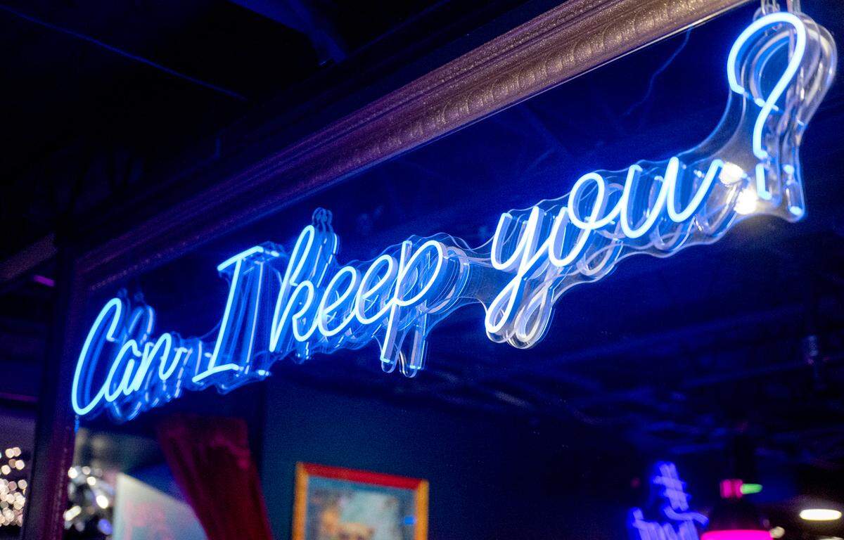Neon signs and mirrors are among the decorations at The Hideaway in downtown State College.