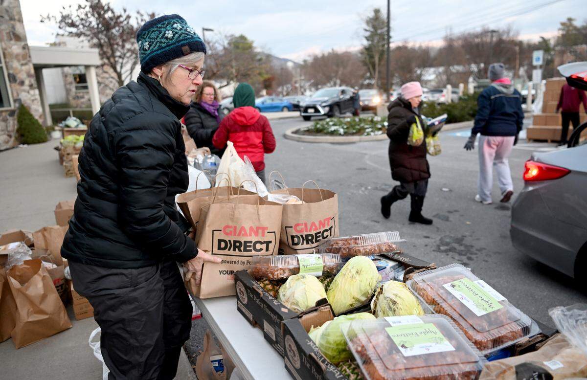 Food is organized for the YMCA Anti Hunger Program’s distribution at the Grace Lutheran Church in State College on Thursday, Nov. 17, 2022.