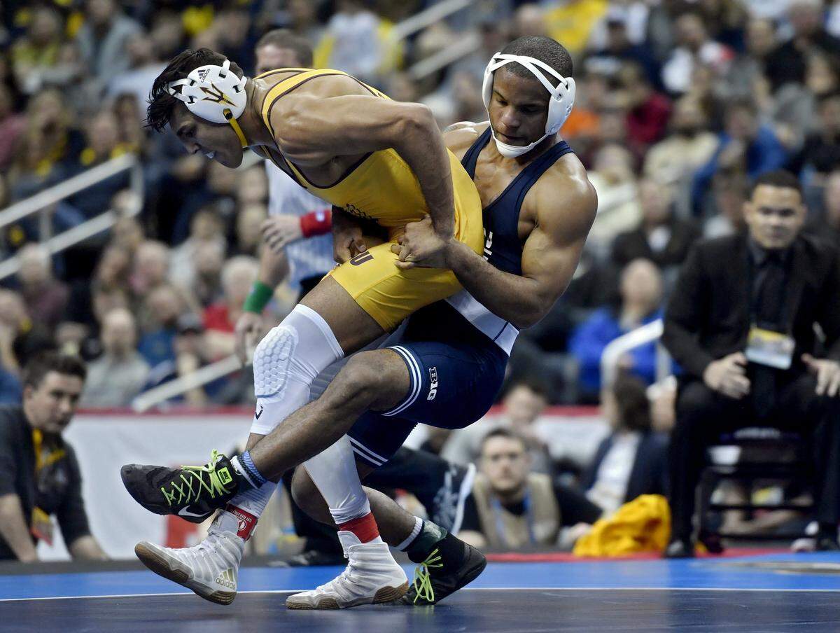 Penn State’s Mark Hall tries to pull down ASU’s Zahid Valencia in the 174 lb championship bout at the NCAA Division 1 Wrestling championships on Saturday, March 23, 2019 at PPG Paints Arena. Valencia won, 4-3.