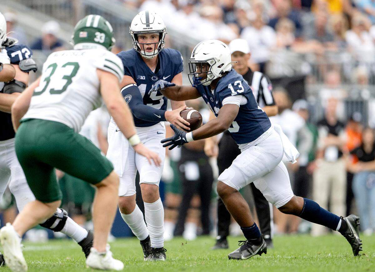 Penn State quarterback Drew Allar hands off to running back Kaytron Allen during the game against Ohio on Saturday, Sept. 10, 2022.