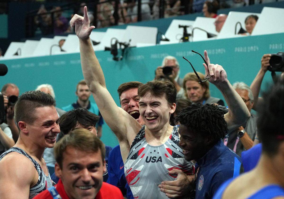 Stephen Nedoroscik reacts with teammates after he performs on the pommel horse during the men's team final during the Paris 2024 Olympic Summer Games at Bercy Arena. 