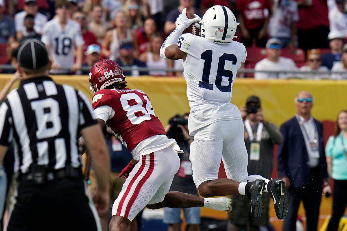 Penn State safety Ji’Ayir Brown intercepts a pass intended for Arkansas wide receiver Warren Thompson during the first half of the Outback Bowl on Saturday.
