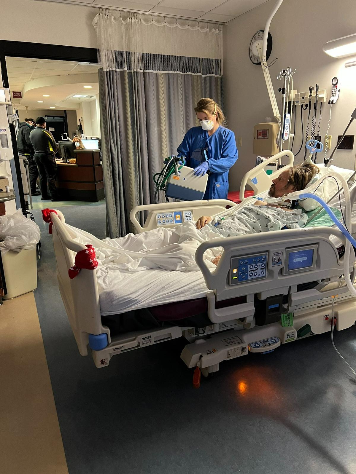 A nurse prepares Ted Edwards for transport from the Mount Nittany Medical Centre COVID unit to a inpatient therapy center in Harrisburg in January 2021.