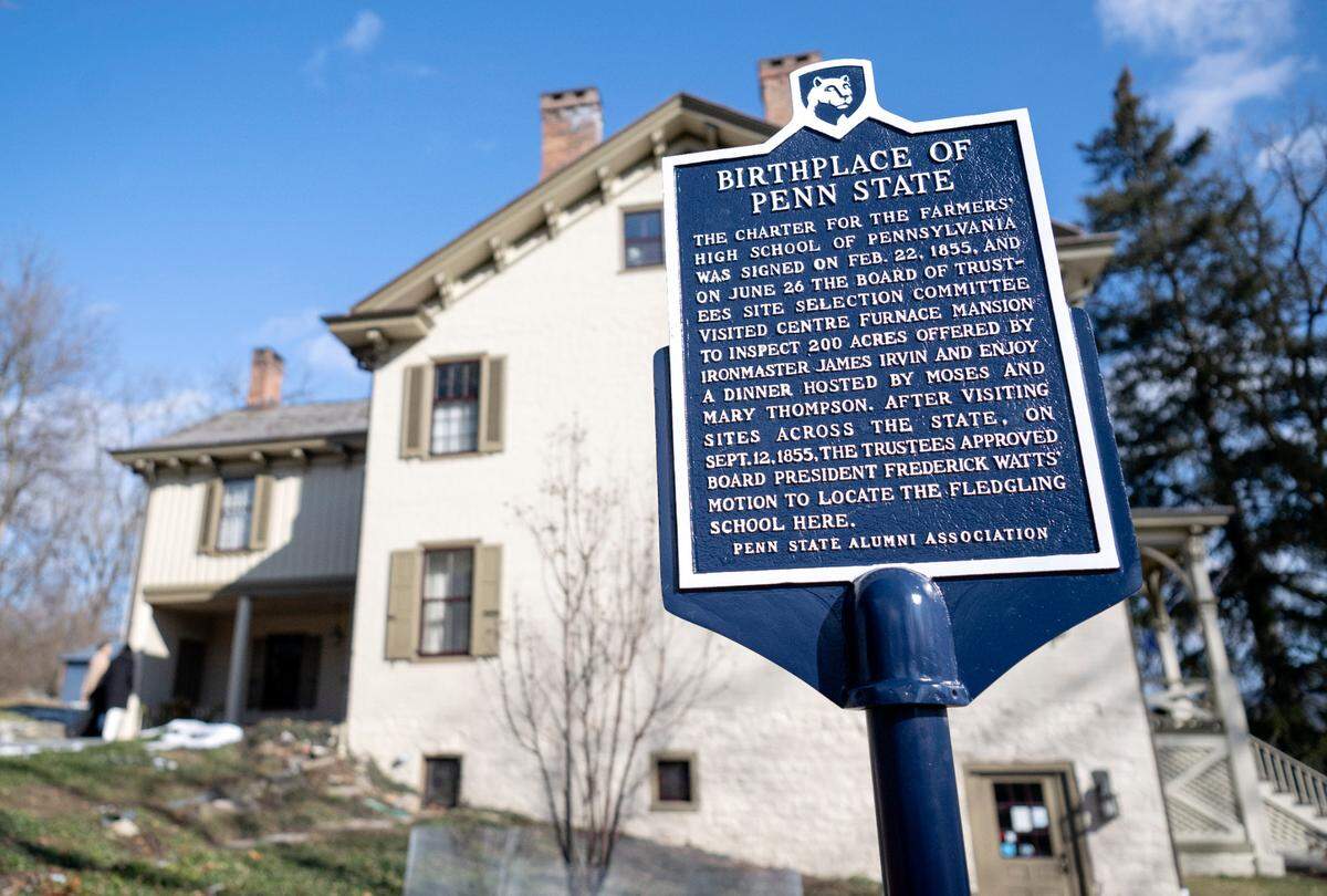 A new sign on the grounds of the Centre Furnace Mansion honors it being the birthplace of Penn State.