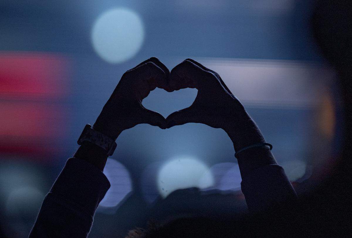 A fan makes a heart with their hands as Journey plays at the Bryce Jordan Center on Wednesday, May 27, 2026.  