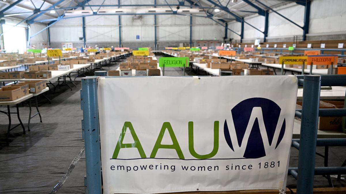Volunteers set up for the AAUW used book sale at the Penn State Snider Agriculture Arena on May 11, 2023. This year’s sale will be held May 17-20.