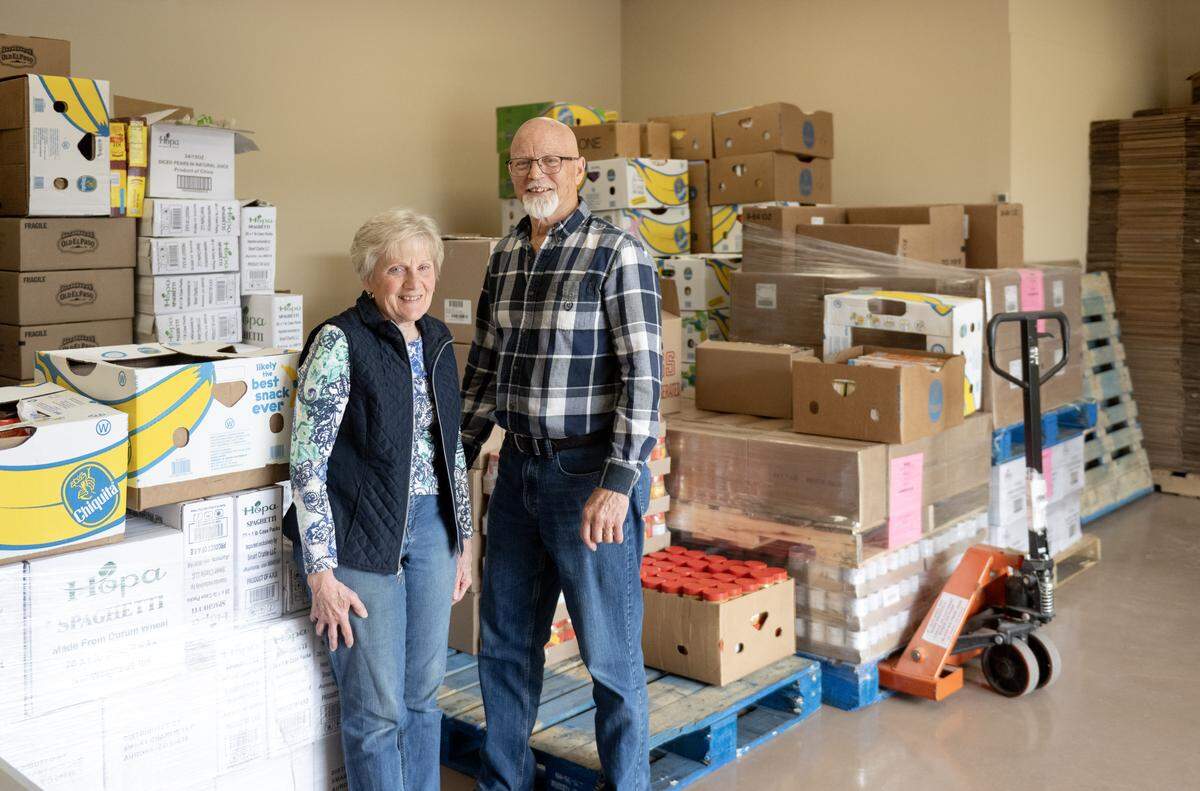 Sheryl and Jim Leaman stand next some of the non-perishables for the next distribution at Common Food space in Port Matilda on Tuesday, May 12, 2026. 