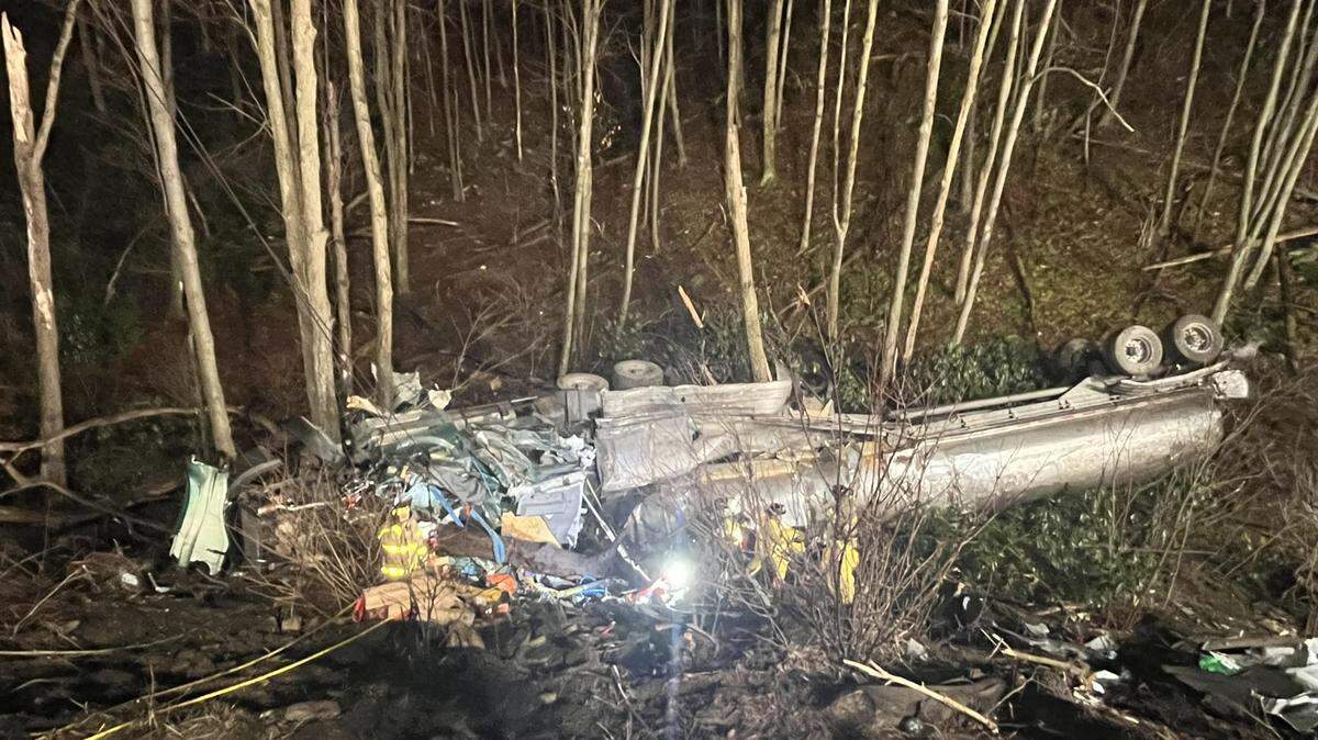 Emergency responders worked for two hours to extricate the driver of a tanker truck that crashed over an embankment on Upper Flat Rock Road on Saturday night.