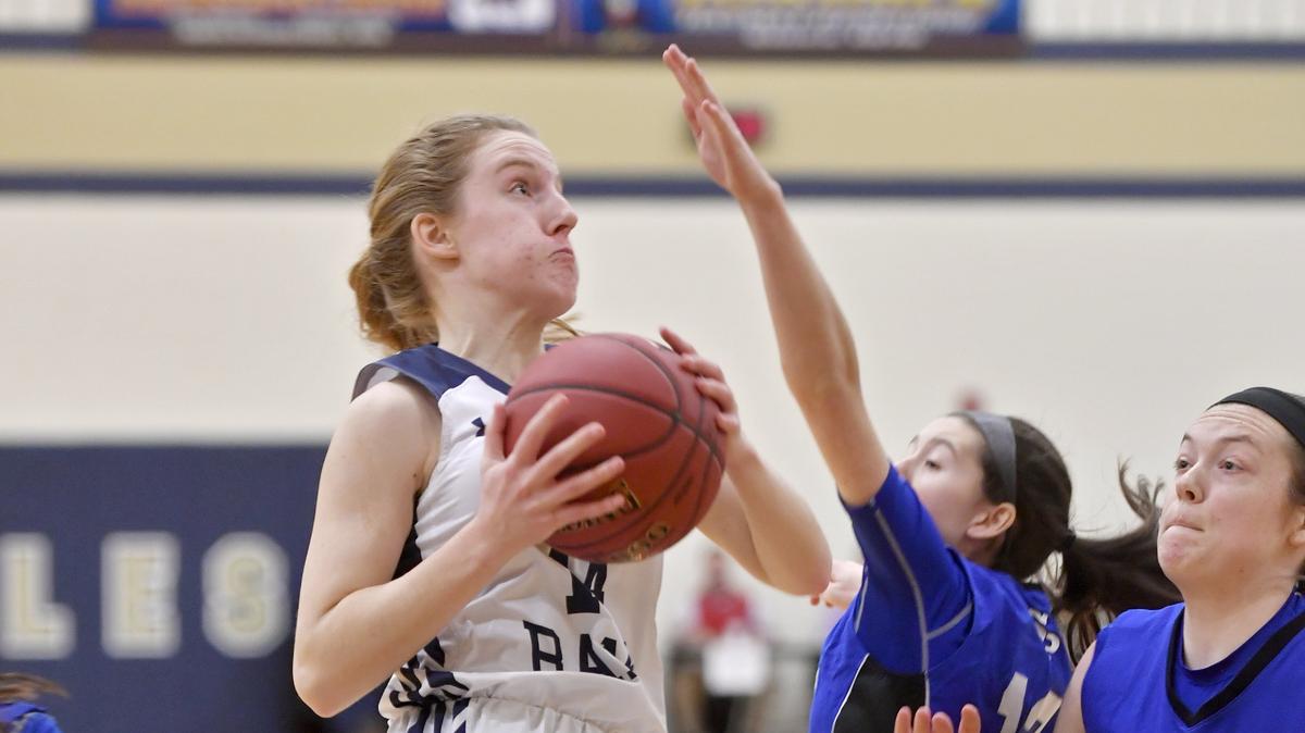 Penns Valley’s Hannah Montminy goes in for a basket over South Park defenders during the game on Friday, March 8, 2019.