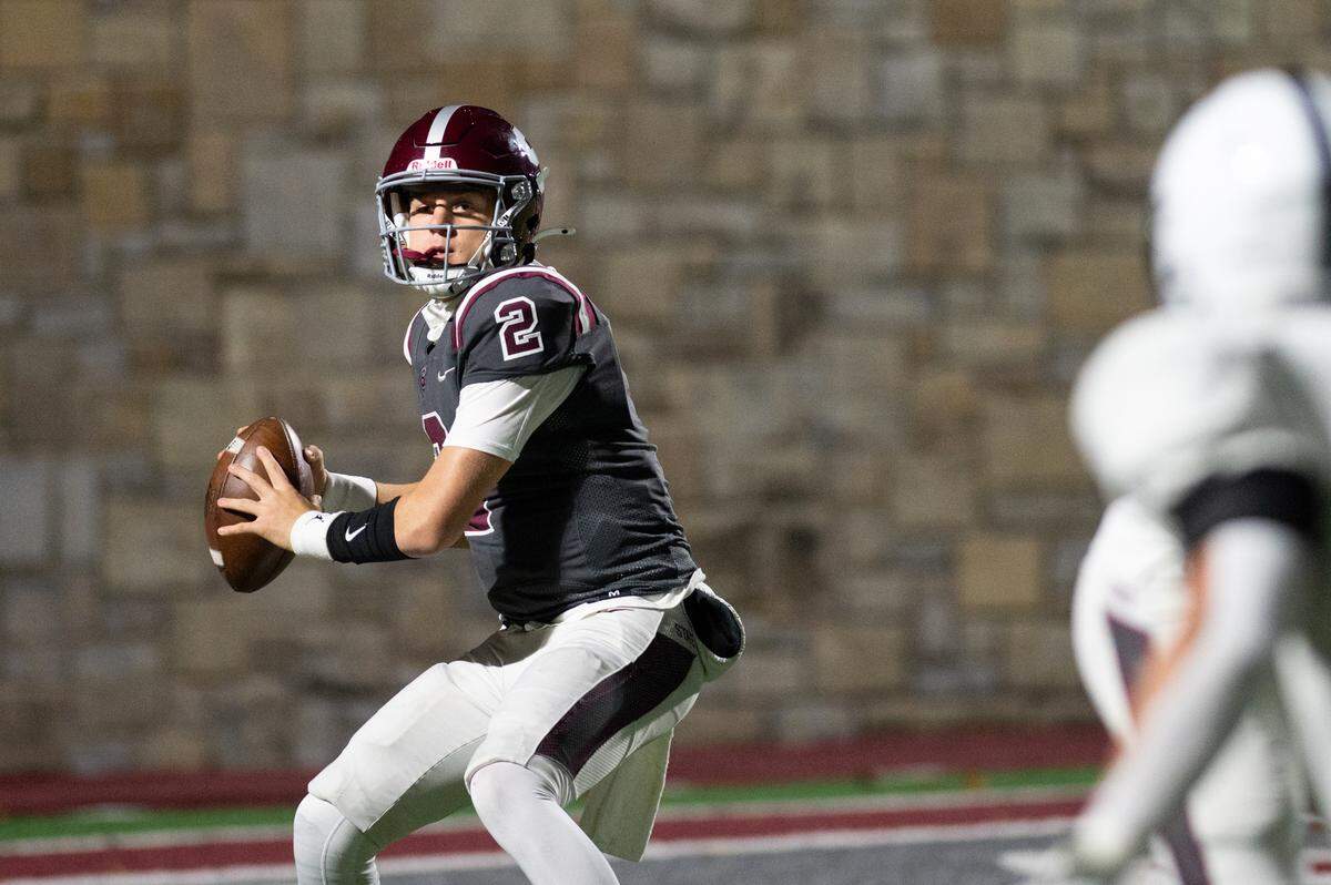 State High quarterback Eddie Corkery prepares to throw the ball during the football game at Memorial Field on Friday, Nov. 8, 2024.