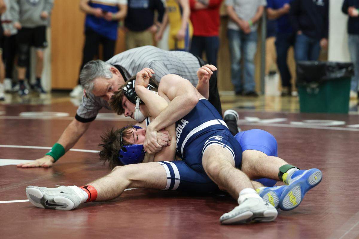 Philipsburg-Osceola’s Ace Foster looks to pin Chestnut Ridge’s Austin Bernash in their 133-pounds second round match of the PIAA Class 2A Southwest Regionals Championships on Friday, Feb. 27, 2026 in Altoona. Bernash edged Foster, 9-8.