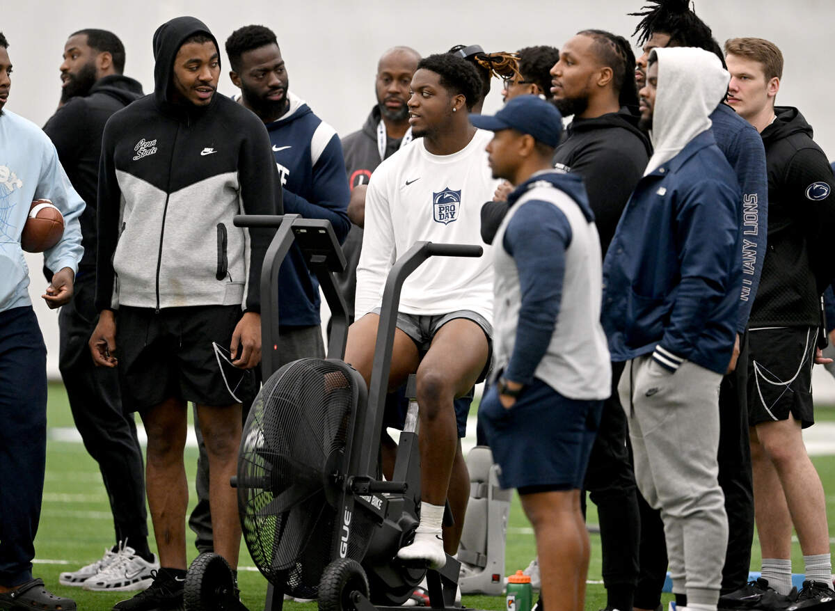 Friends and teammate surfing defensive end Adisa Isaac as he warms up to run position drills for NFL scouts at Penn State’s Pro Day on Friday, March 15, 2024 in Holuba Hall.