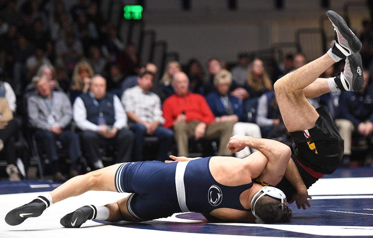 Penn State’s Vincenzo Joseph (left) takes down Maryland’s Kyle Cochran enroute to a pin fall during Sunday’s meet at Rec. Hall. Penn State defeated Maryland, 40-3. (For the CDT/Steve Manuel)