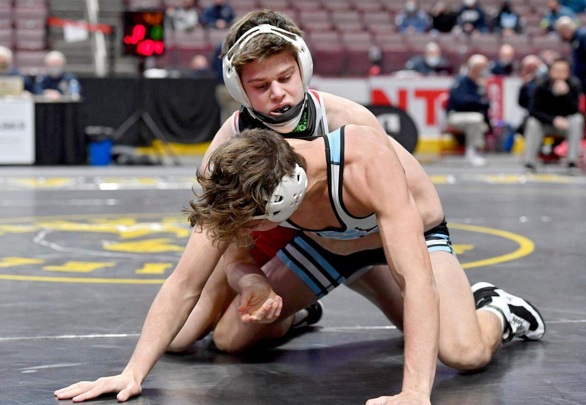 Bellefonte’s Jude Swisher controls Seneca Valley’s Dylan Chappell in the 132 lb semi-final bout at the PIAA 3A wrestling championships on Saturday, March 13, 2021 at the Hershey Giant Center.