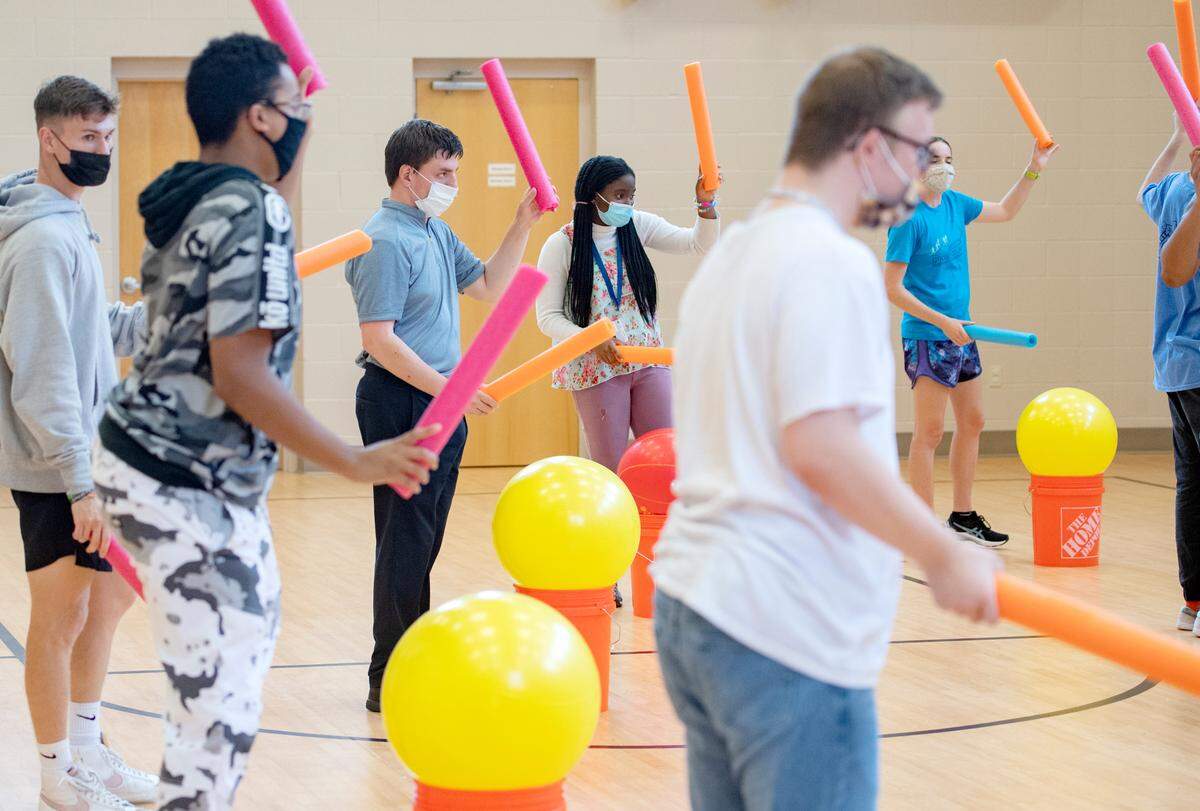 Participants enjoy the Happy Valley FitLink cardio drumming class on Wednesday.
