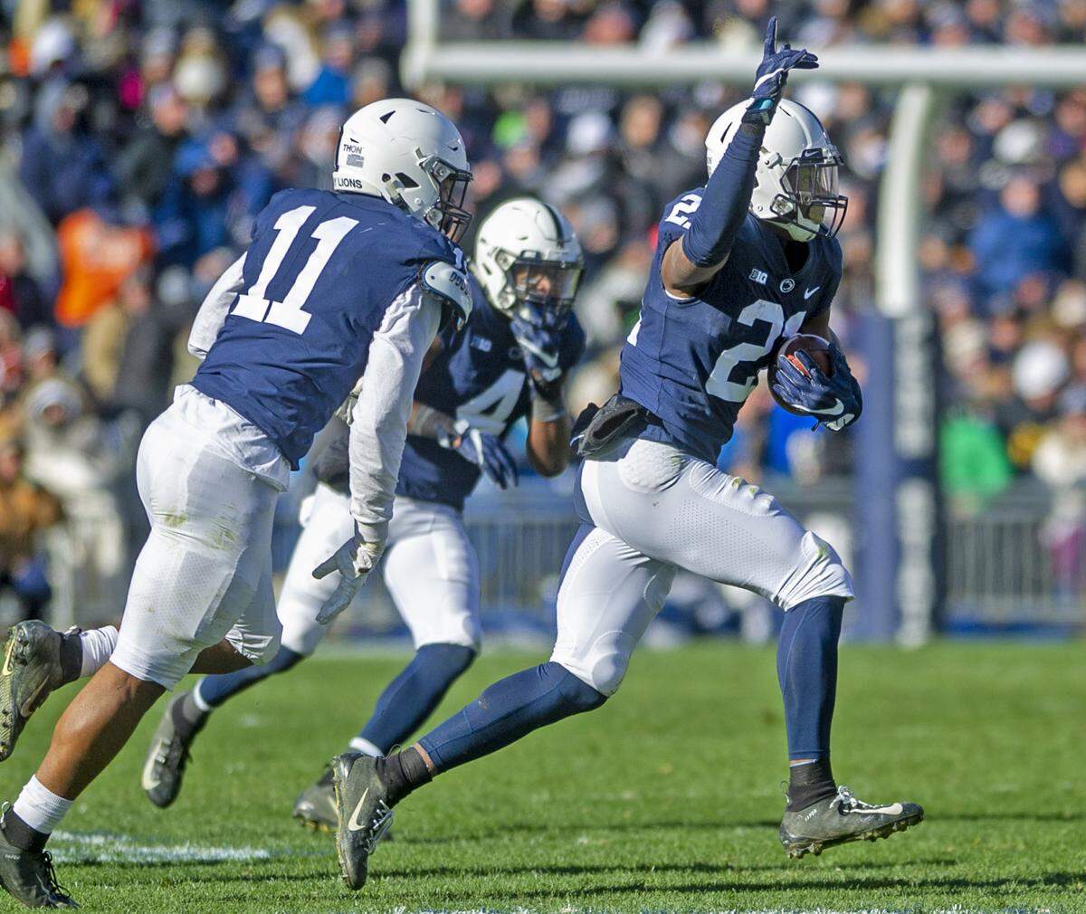 Penn State cornerback Amani Oruwariye (21) celebrates his interception during the game against Wisconsin at Beaver Stadium on Saturday, Nov. 10, 2018. No. 20 Penn State beat the Badgers 22-10.