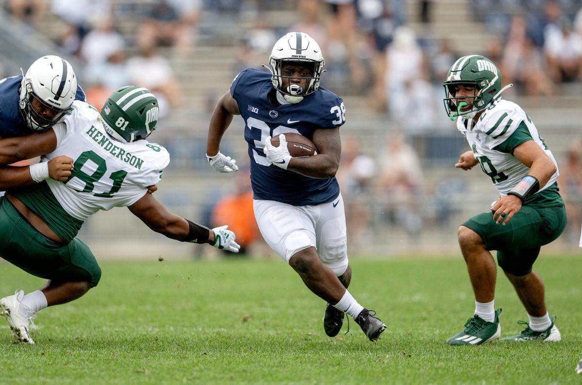 Penn State running back Tank Smith cuts down the field with the ball from Ohio defenders during the game on Saturday, Sept. 10, 2022.